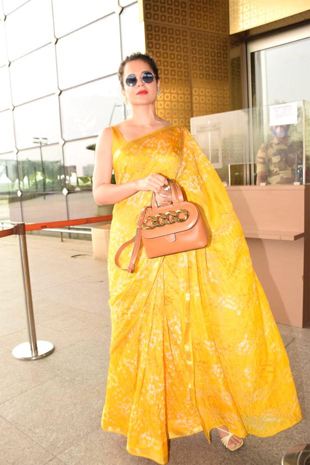 Kangana exuded radiance as she stepped out in a vibrant yellow saree. 